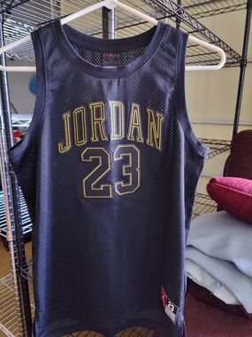 Jordan Black and Gold Mesh Basketball Jersey.